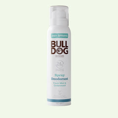 A white can of Fresh Mint & Cedarwood Spray Deodorant features teal and brown text, a clear cap, and contains 125 ml. Made with natural origin ingredients, this Bulldog Skincare vegan deodorant offers a refreshing scent.