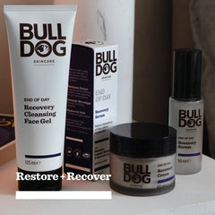 The End of Day Collection Bundle features Bulldog Skincare’s Recovery Cleansing Face Gel, Recovery Serum, and Recovery Cream made with natural origin ingredients. Text at the bottom reads: Restore + Recover.