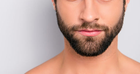 Bearded man against grey background
