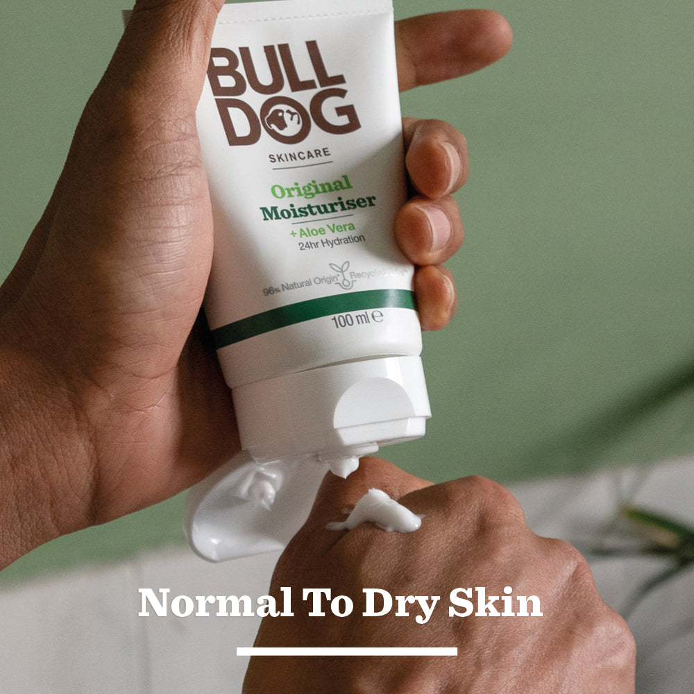 Someone squeezes Original Moisturiser onto the back of their hand. The image text says: Normal to Dry Skin and features natural origin ingredients.