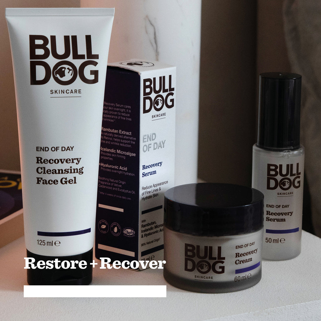 The End of Day Collection Bundle features Bulldog Skincare’s Recovery Cleansing Face Gel, Recovery Serum, and Recovery Cream made with natural origin ingredients. Text at the bottom reads: Restore + Recover.